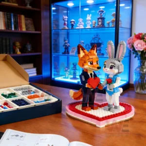 Building block fox and bunny couple on a heart shaped base on a desk beside an open parts box and instruction booklet with a blue lit display cabinet behind!