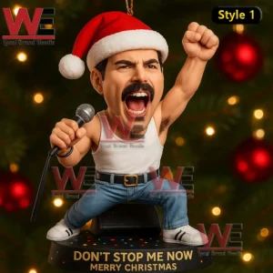 Christmas ornament of a singer figure with Santa hat microphone and energetic pose in front of holiday lights!