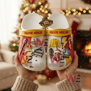 Freddie Mercury Crocs Clogs With Charms 5 Hands holding Freddie Mercury themed clogs decorated with musical and festive charms in a holiday setting!