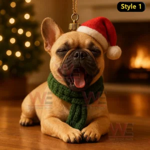 A French Bulldog ornament lying down with a Santa hat and green scarf in a warm festive setting!