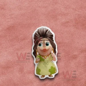 Cartoon girl pillow with green dress shown on a pink fabric background!
