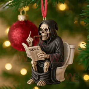 A Christmas tree ornament of a hooded skeleton on a toilet reading a news paper with a cigar in hand surrounded by festive lights!
