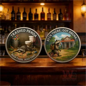 Two novelty coins with raccoon illustrations displayed on a bar counter in a cozy bar setting!
