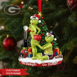 A Christmas ornament depicts two green cartoon characters in Georgia Bulldogs