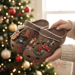 George Strait Christmas Crocs Clogs with Charms 4 Brown George Strait Christmas clogs with festive charms held before a decorated Christmas tree!
