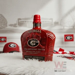 A red Georgia Bulldogs anniversary bottle with a fierce bulldog emblem placed on a white rug surrounded by team themed decor!