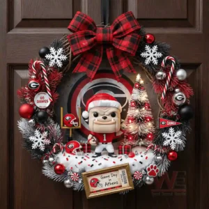 A holiday wreath with a mascot figure team colors snowflakes and ornaments displayed on a wooden door!