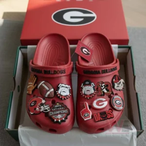 Georgia Bulldogs 2025 SEC Champions Crocs Clogs with Charms 5 A pair of red Georgia Bulldogs clogs filled with themed charms arranged neatly inside an open box!