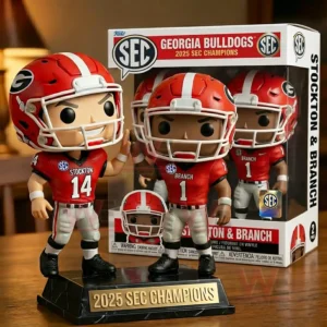 Collectible football player figures in red uniforms standing on a championship display base in front of a matching box!