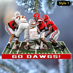 A group of Georgia Bulldogs defenders tackling opponents on a miniature football field ornament with a team slogan at the bottom!