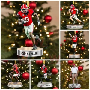 Multiple Georgia Bulldogs player ornaments posed in action hanging in front of a decorated Christmas tree!