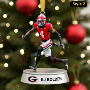 A KJ Bolden ornament showing him in a sprinting pose hanging above a nameplate in front of a Christmas tree!