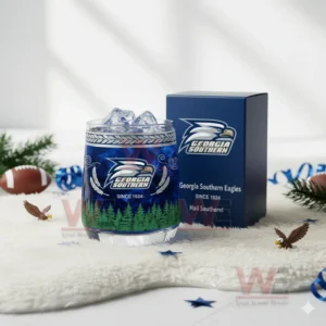 Georgia Southern Eagles whiskey glass with ice next to a blue branded box on a white decorative background!