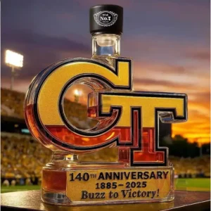 Georgia Tech GT bottle with black cap and anniversary plaque in front of a sunset stadium.