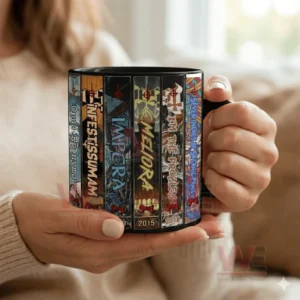 Black ceramic mug with vertical album inspired artwork held by hands in a cozy indoor setting!