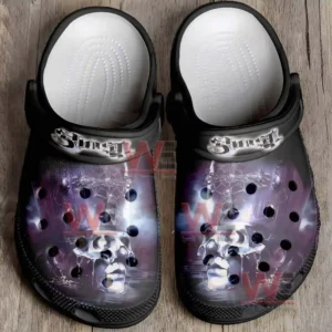 Top view clogs with centered skull graphics and textured footbed.