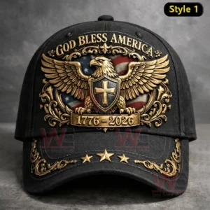 Front view of a black cap with God Bless America text a gold eagle crest American flag background a cross shield and 1776 to 2026 embroidery.