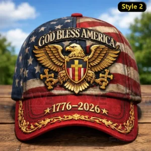 Patriotic cap with an American flag pattern God Bless America embroidery a gold eagle crest with a cross shield and 1776 to 2026 on a red brim.