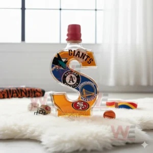 An S shaped bottle with team logos stands on a rug near a window with sports accessories around it!