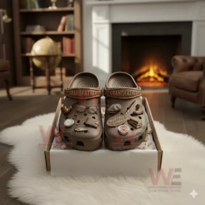 Brown grandfather themed clogs with vintage charms displayed in a cozy room with a fireplace.