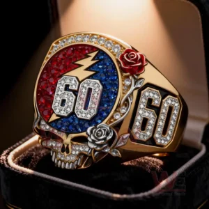 Gold anniversary ring with skull design colorful gemstones and number sixty displayed in a jewelry box!