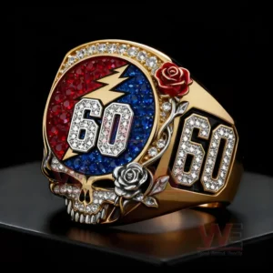 Greatful Dead 60th Anniversary Tribute Skull and Roes Ring 5 Skull design anniversary ring with colorful gemstones displayed on a dark pedestal!