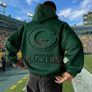 Back view of a green Green Bay Packers hoodie with embossed logo worn on a football field!