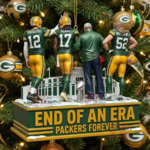 A group of small figures representing Packers players and a coach posed on a stand in front of a Christmas tree decorated with green gold and white ornaments!