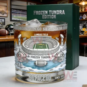 Green Bay Packers Frozen Tundra Lambeau Field Go Pack Go Whiskey Glass 3 Close up of a football stadium themed whiskey glass with ice and detailed artwork on a bar counter!