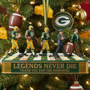 A row of small figures representing famous Packers legends positioned on a platform in front of a Christmas tree decorated with team themed ornaments and football elements!
