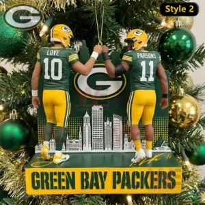 Green Bay Packers ornament showing two players in green and yellow uniforms fist bumping with a stylized city skyline behind them!