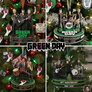Miniature musicians posed with instruments on holiday ornaments celebrating the group anniversary hanging among colorful Christmas tree decor!