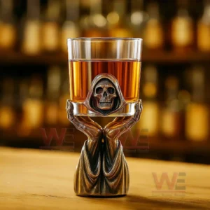 Grim Reaper Whiskey Holder 10 Single grim reaper whiskey glass standing on a wooden bar surface!