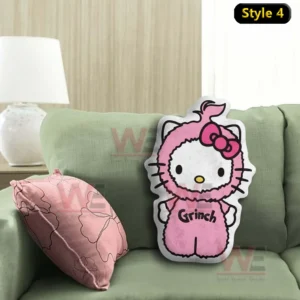 Grinch Hello Kitty Custom Shaped Pillow 9 Cartoon cat shaped pillow in a pink holiday outfit displayed on a green sofa!
