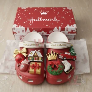 Red Hallmark themed clogs decorated with various Christmas charms displayed inside a festive box!