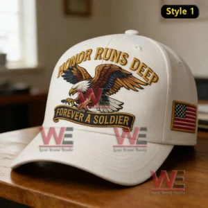 White cap with eagle embroidery and honor themed text resting on a wooden surface indoors!