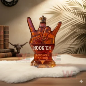 Amber Longhorn hand shaped bottle on white fur with warm room decor behind it!