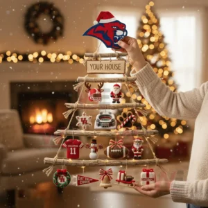 A person holding a rustic wooden branch Christmas wall tree decorated with Houston Cougars themed ornaments in a festive living room!
