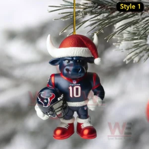 A Texans bull mascot ornament wearing a Santa hat and holding a helmet hanging on a snowy tree branch!