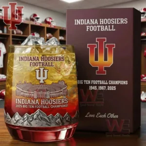 A whiskey glass with Indiana Hoosiers championship designs placed beside a printed box in a locker room setting!