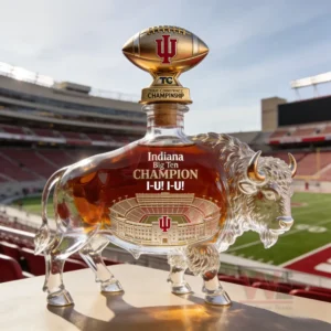 Buffalo shaped whiskey bottle with amber liquid and stadium artwork set against a football stadium view!