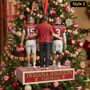 A Christmas tree ornament showing two Indiana players and a man in a red shirt standing together with arms linked before a decorated tree!