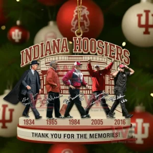 Indiana Hoosiers ornament showing five head football coaches with signatures years and a tribute message hanging in front of holiday decorations.
