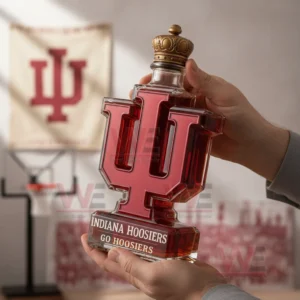 Person holding a red letter whiskey bottle with a crown stopper in a sports themed interior!