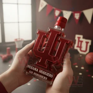 Hands presenting a red letter whiskey bottle in a decorated university themed space!