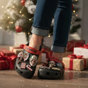 Person wearing black carnival themed clogs with clown skull and holiday charms in a Christmas living room!