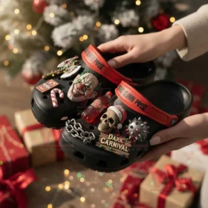 Insane Clown Posse Crocs Clogs with Charm 4 Hands holding black carnival themed clogs with clown skull candy and chain charms near holiday decorations!