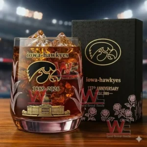 Iowa Hawkeyes 137th anniversary whiskey glass with gold designs displayed next to a black gift box.