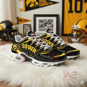 Iowa Hawkeyes themed sneakers with customizable name text arranged among team memorabilia in a fan themed room!