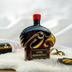 Iowa Hawkeyes Whiskey Bottle 8 Hawk shaped Iowa bottle with red cap on white fur with black and gold decor around it!